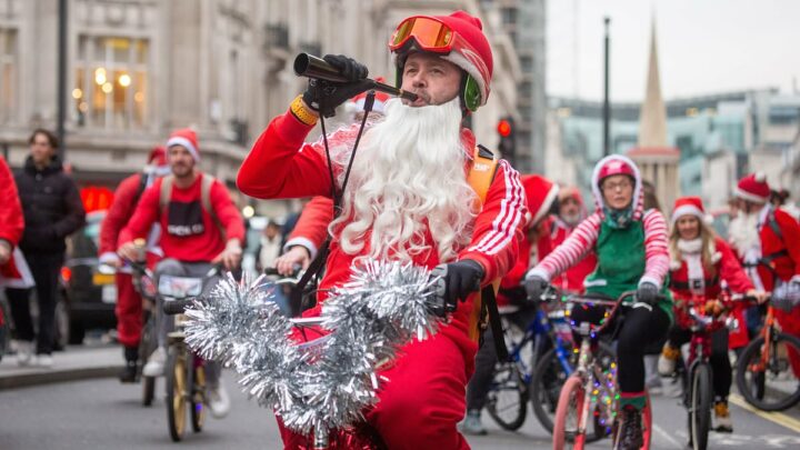 Festive cyclists dressed as Father Christmas take to streets of London