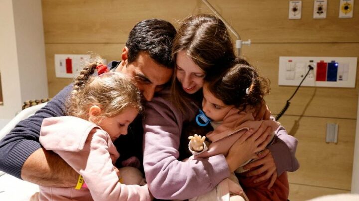 Emotional moment girl is hugged tightly by family after being hostage