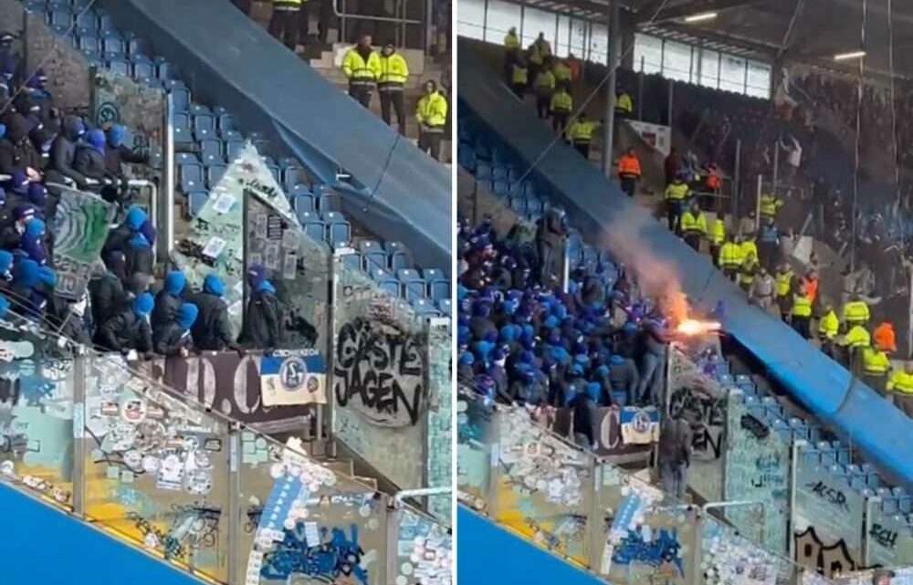 Scary moment Schalke hooligans kick through stadium barriers and set off fireworks over rival fans as match is delayed | The Sun